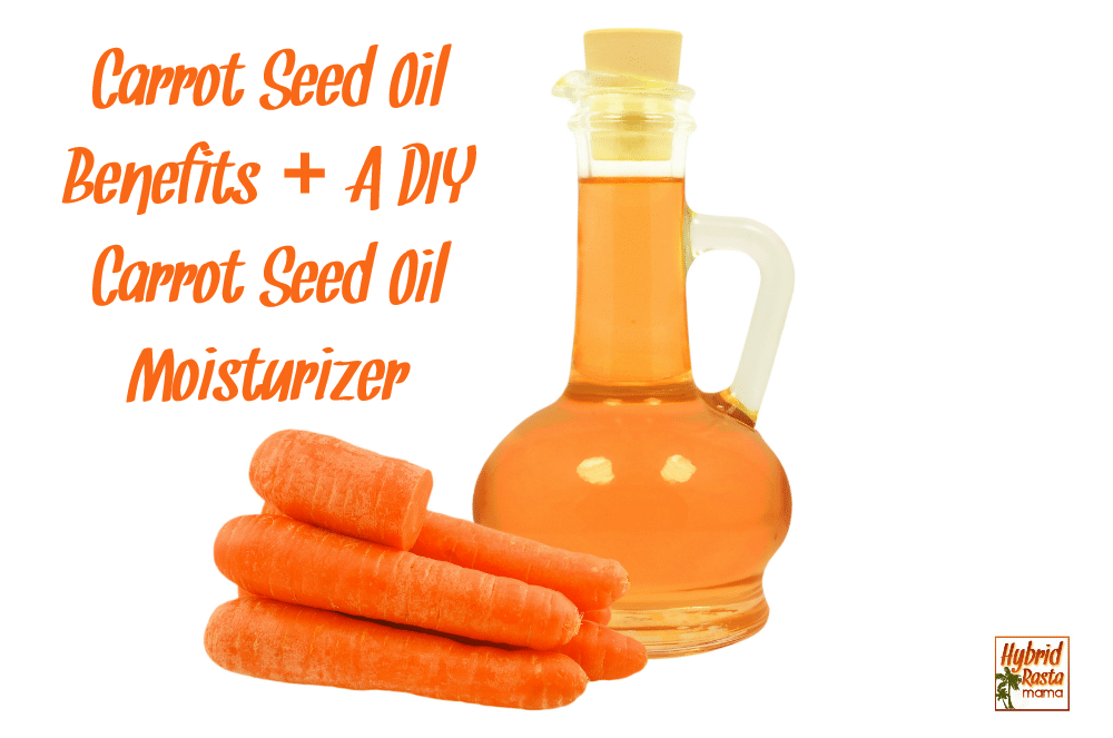 A bottle of carrot seed oil next to carrots