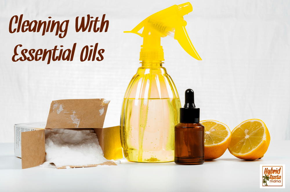 An essential oil cleaner in a yellow spray bottle. There are orange slices, an essential oil bottle, baking soda, and scrubbing pads next to it.