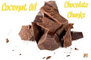 Coconut oil chocolate chunks in a pile on a white background