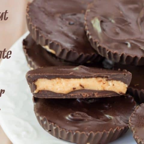 Coconut oil nut butter cups on a white plate with light tan background