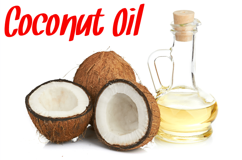 A jar of coconut oil next to coconuts