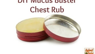 DIY Mucus Buster Chest Rub in a red round tin on a white backgroun