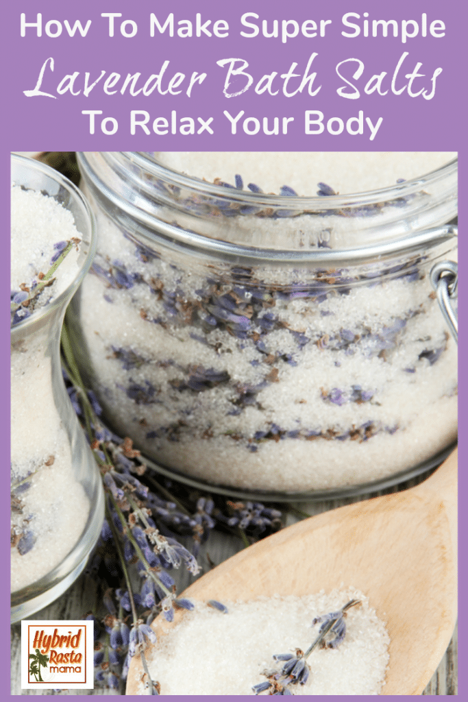 Lavender bath salts in a large glass jar with sprigs of lavender around the jars