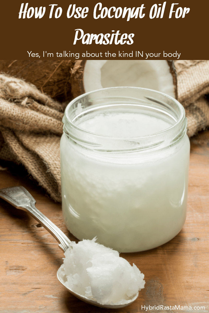A jar of coconut oil and a silver spoon with coconut oil on it