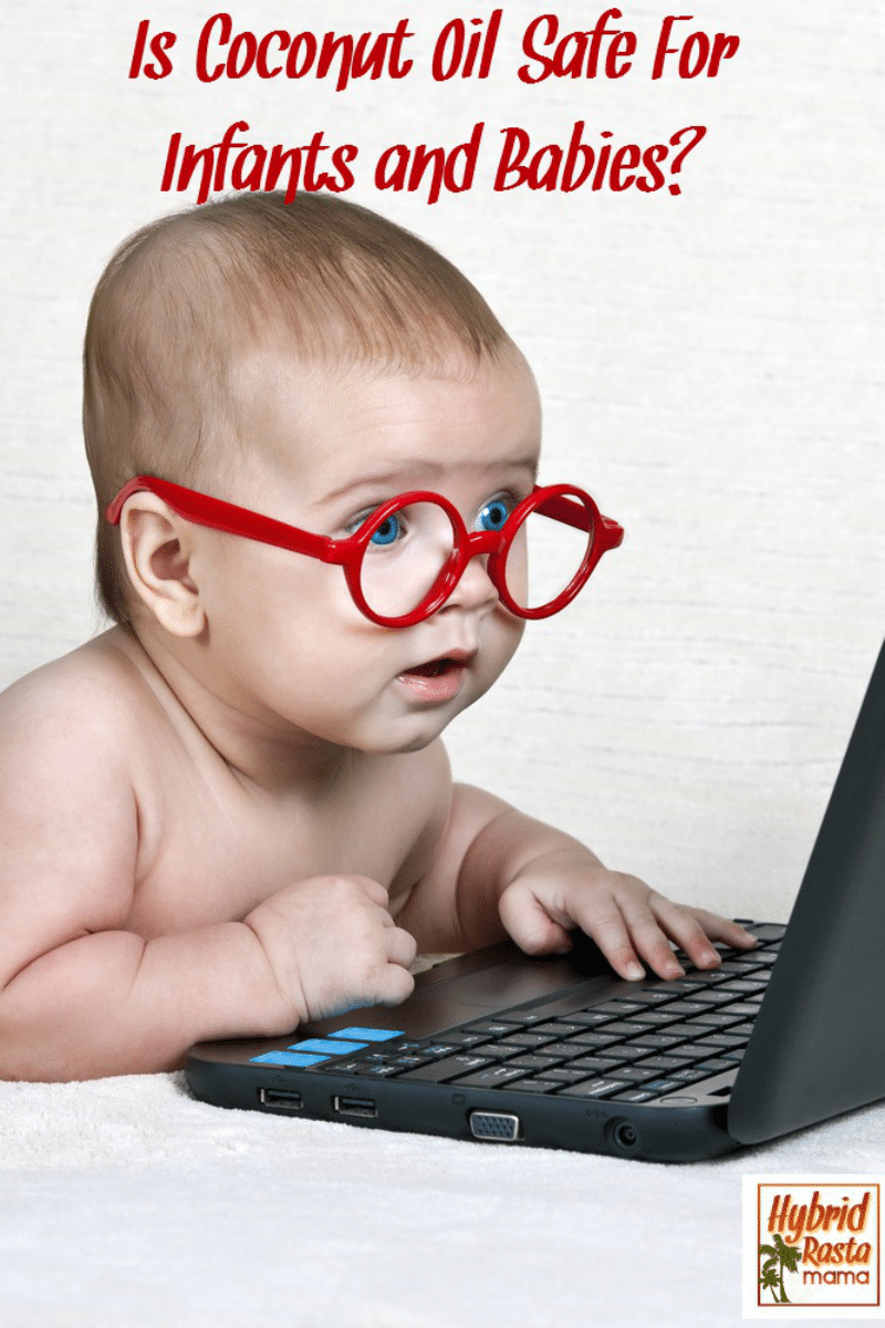 Baby with red glasses sitting at a laptop researching if coconut oil is safe for babies.