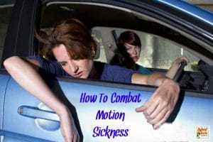 Teen with motion sickness hanging out the window of car with mom looking on