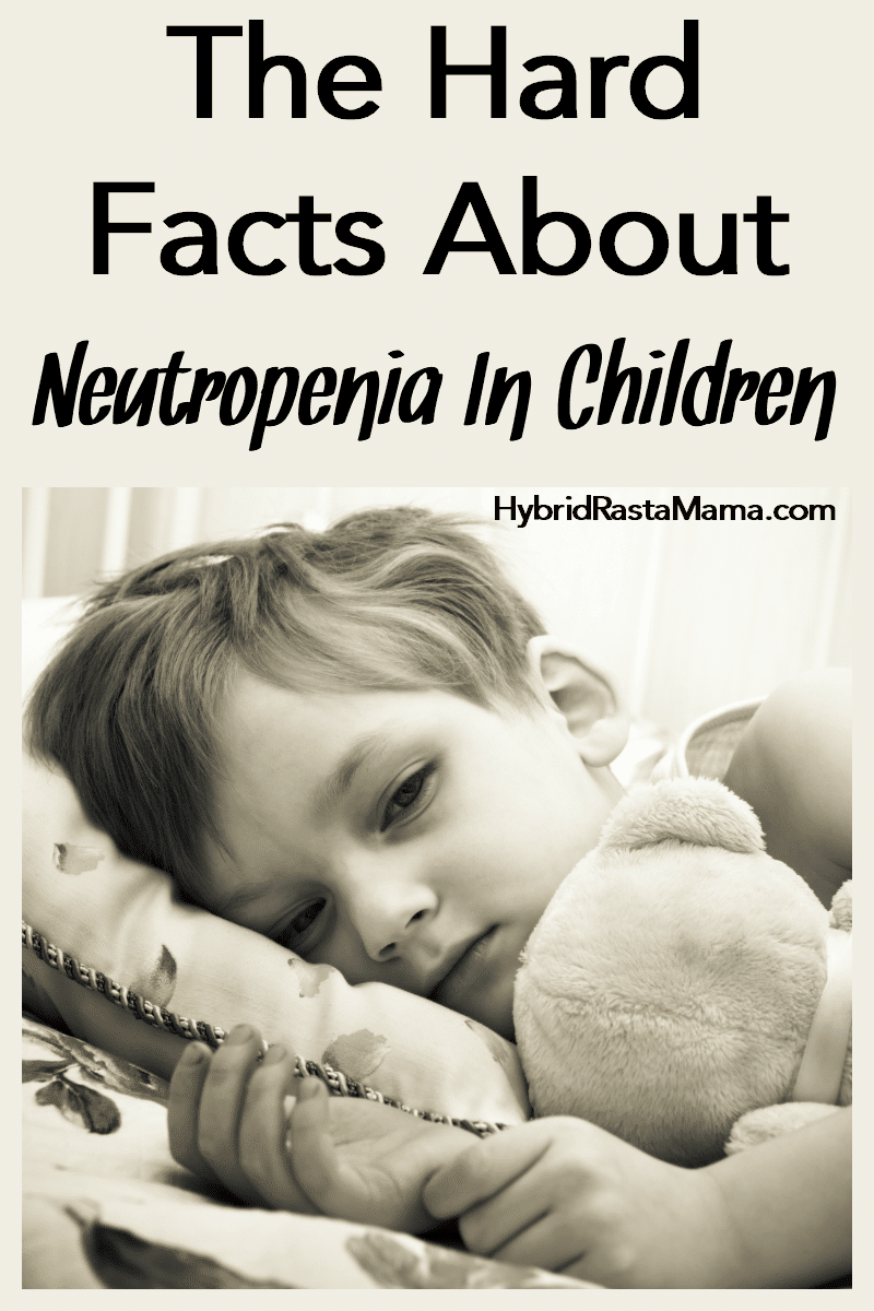 A sick little boy lying in bed with his teddy bear. He is neutropenia. 